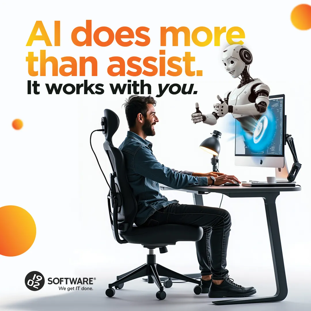Man sitting at desk working on computer with a robot emerging from screen giving thumbs up, text "AI does more than assist. It works with you."