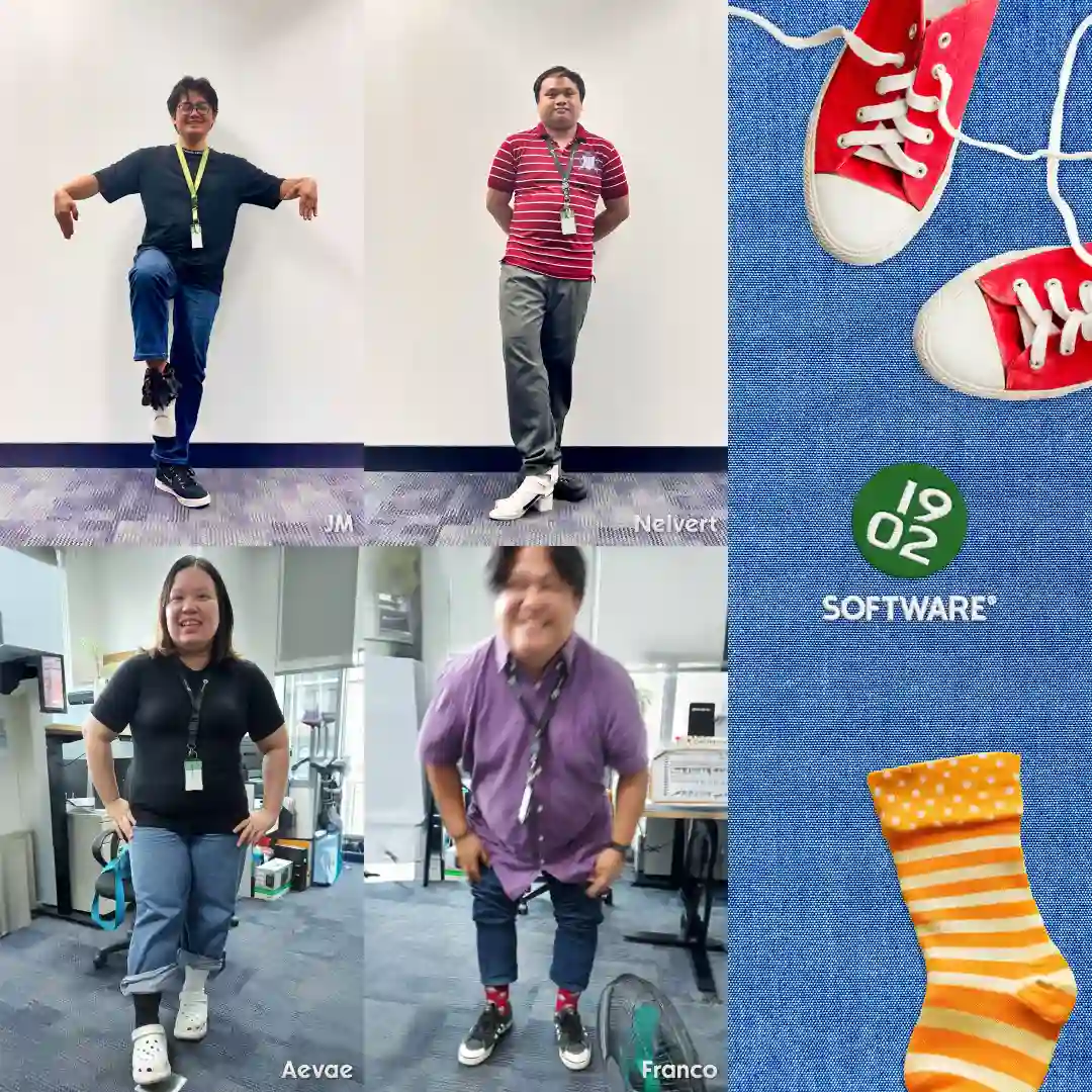 Four employees JM, Nelvert, Aevae, and Franco wearing mismatched socks and posing in an office, with 1902 Software logo and red sneakers on blue fabric background.