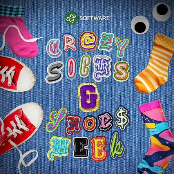 Colorful embroidered letters spelling "Crazy Socks & Shoes Week" on blue fabric, surrounded by bright socks, red sneakers, and googly eyes