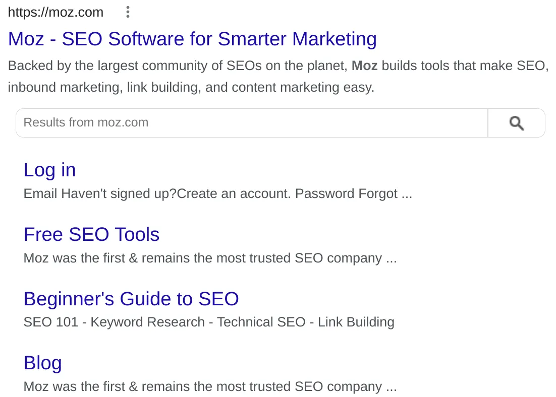 Google search result for Moz showing sitelinks searchbox schema with a site-scoped search box and sitelinks for Log in, Free SEO Tools, Beginner's Guide to SEO, and Blog